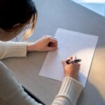 Student writing an ESS essay paragraph