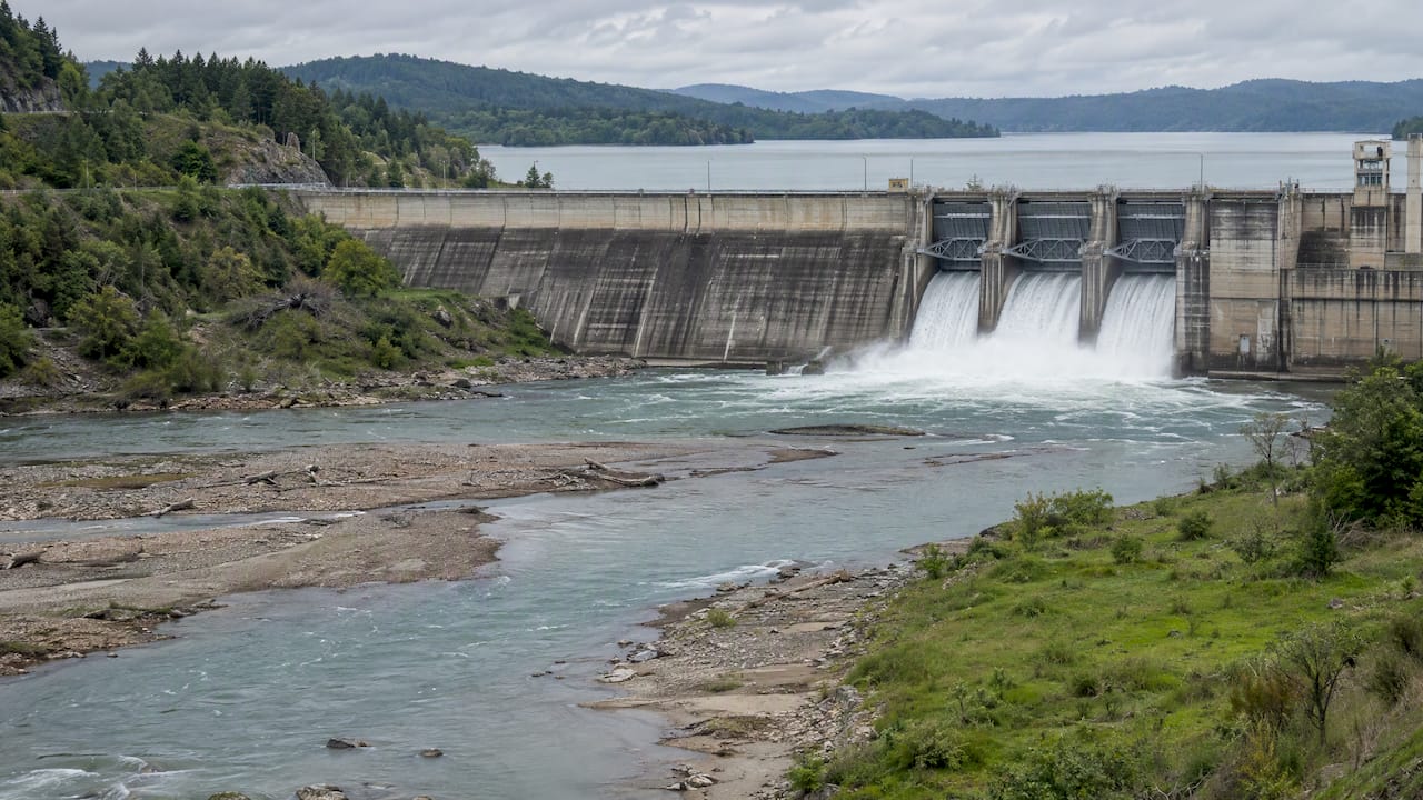 Dam altering downstream freshwater river flow